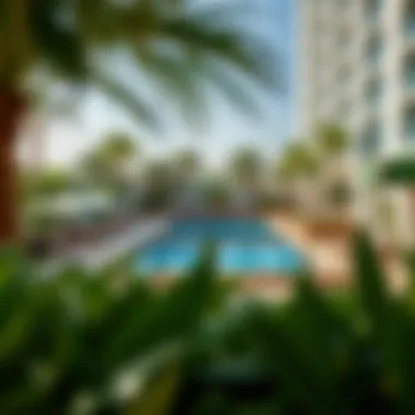 Relaxing Oasis at Holiday Inn Dubai Science Park Inviting pool area surrounded by lush greenery and sun loungers